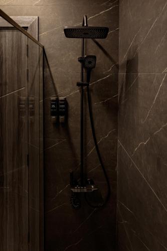 a shower in a bathroom with a shower at Palazzo hotel in Kuwait