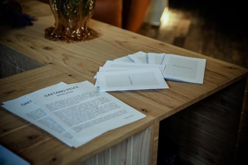 a wooden table with papers on top of it at Benci House in Florence