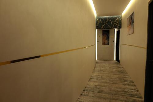 a hallway with a long corridor with a hallway at Palazzo hotel in Kuwait