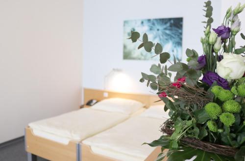 Seminarhotel in der Manfred-Sauer-Stiftungにあるベッド