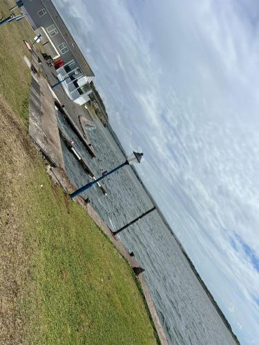 an aerial view of a wall with water in a field at Lake District Caravan Holiday in Millom