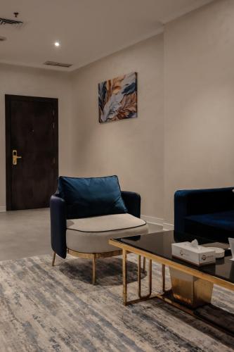 a living room with a couch and a coffee table at Palazzo hotel in Kuwait