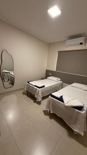 En eller flere senge i et værelse på Loma Sweet Home