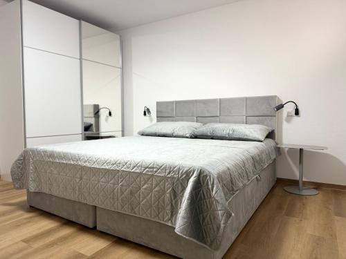 a bedroom with a large bed with a large headboard at Overnight Bubesheim Ferienwohnung in Bubesheim