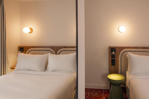 Postel nebo postele na pokoji v ubytování Salvia Paris