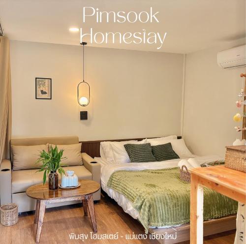 a bedroom with a bed and a couch at PimSook Homestay Riverside ที่พักแม่แตง