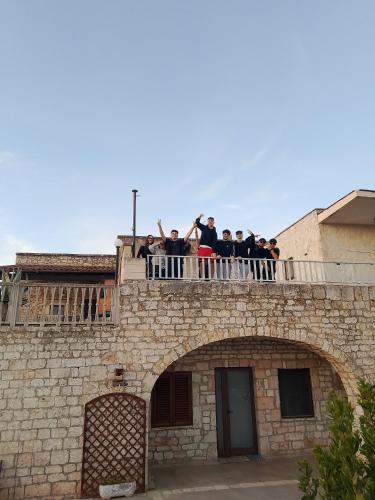 a group of people standing on top of a building at Villa Coco Monopoli in Monopoli