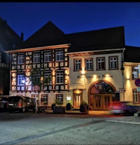 a large building with lights on the front of it at Gasthaus Krone in Weingarten