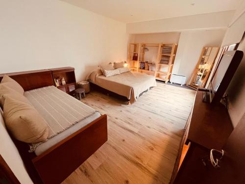 a small bedroom with a bed and a bed sqor at Casa Waikiki in Mar del Plata