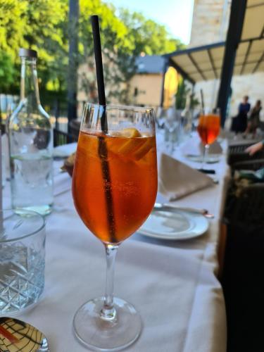 a drink in a glass sitting on a table at Schlosshotel Blankenburg in Blankenburg