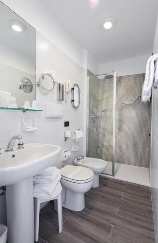 a bathroom with a sink and a toilet and a shower at Best Western Regina Elena in Santa Margherita Ligure