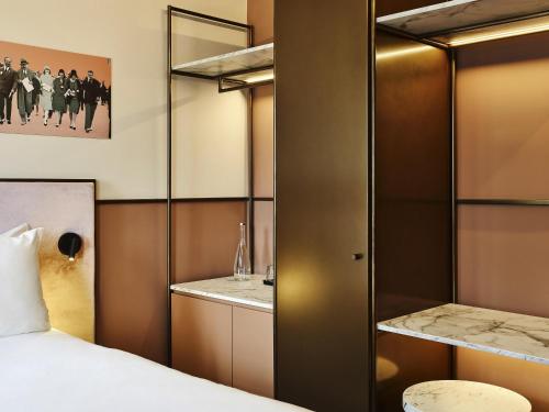 Ένα ή περισσότερα κρεβάτια σε δωμάτιο στο TRIBE Hôtel Le Touquet