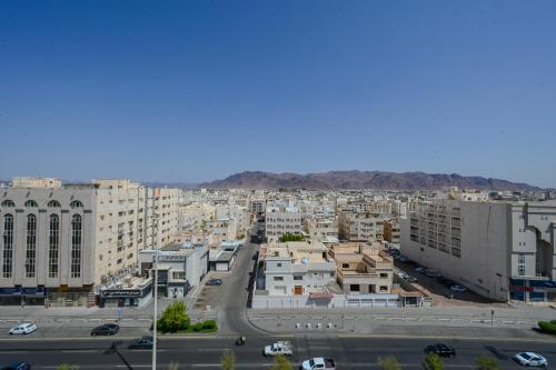 an aerial view of a city with buildings at فندق تيلا TeeLA HoTeL in Medina