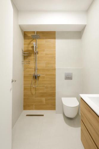 a bathroom with a shower with a toilet and a sink at MONO ALEX Afitos in Afitos