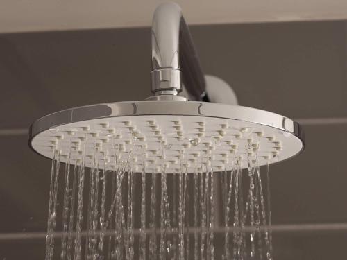 a shower head with water pouring out of it at Novotel Arica in Arica