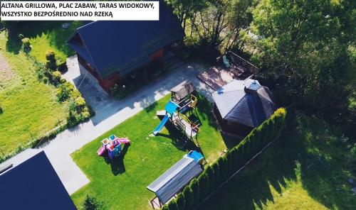 an aerial view of a yard with a train on it at Apartaments Gory in Niedzica Zamek