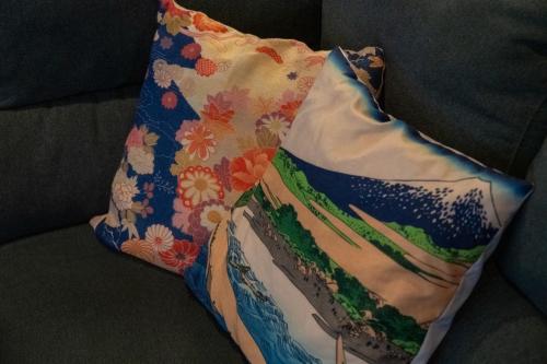 a pillow sitting on top of a couch at sukeemon in Biei