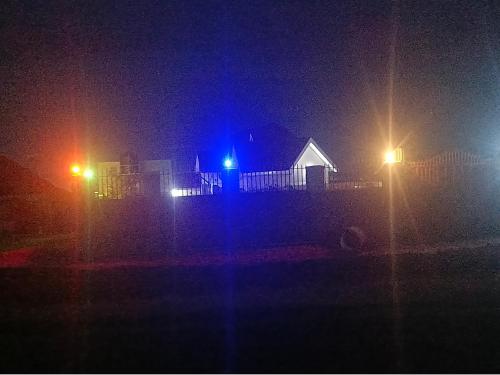 a night view of a building with street lights at Haven Guest House, Kasese in Kasese