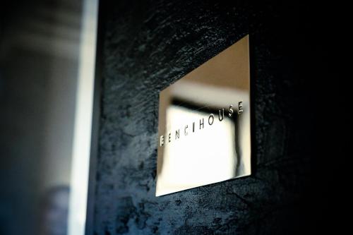 a mirror on a wall with the word bathroom on it at Benci House in Florence