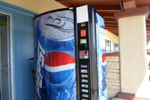 a vending machine with a bottle of water at Hitching Post Studios Inn in Santa Cruz