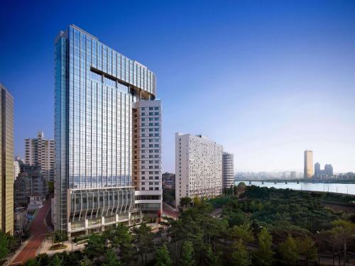 a view of a city with tall buildings at Naru Ambassador Hotel Seoul - MGallery Collection in Seoul