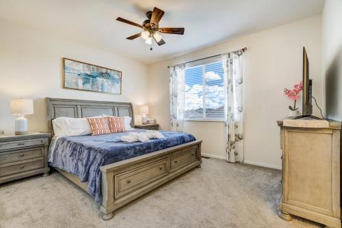 a bedroom with a bed and a ceiling fan at The Cozy Oak - 4BR Family Home in Fountain