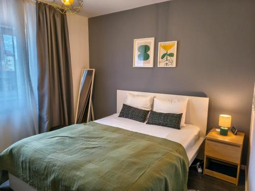 Ένα ή περισσότερα κρεβάτια σε δωμάτιο στο Ospitalier Apartments Student