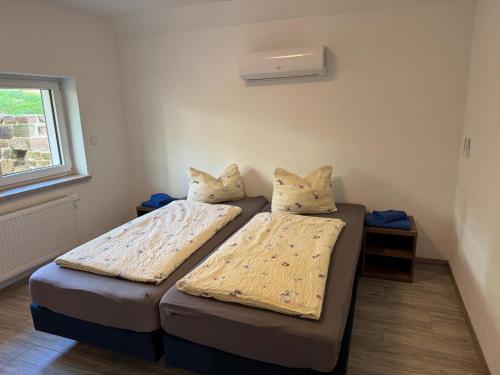 Postel nebo postele na pokoji v ubytování Haus 13 Zum Nordblick