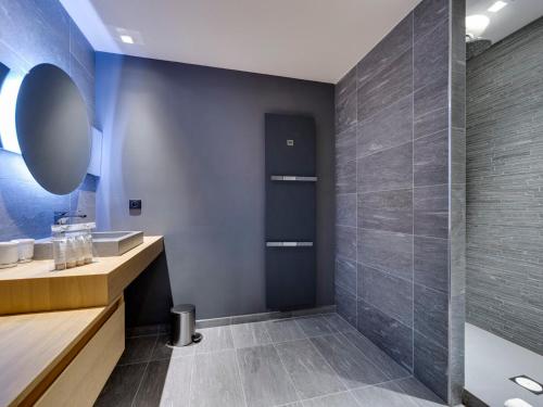 a bathroom with a sink and a shower at Appartement spacieux avec balcon - Tignes le Lac - FR-1-641-83 in Tignes