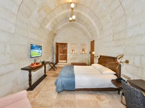 Ένα ή περισσότερα κρεβάτια σε δωμάτιο στο Evanthia Cave Suites - Special Class