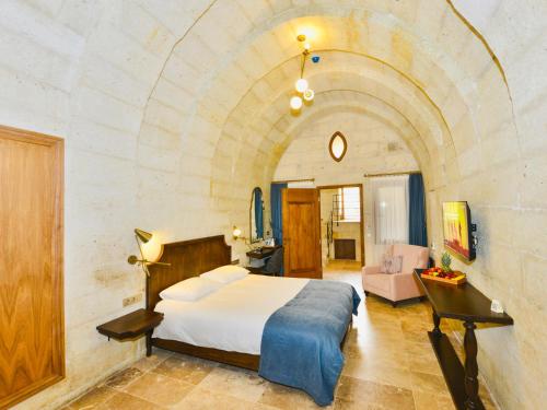 Ένα ή περισσότερα κρεβάτια σε δωμάτιο στο Evanthia Cave Suites - Special Class