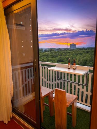 a view of a balcony with a table and chairs at Aqua Horizon Beachside Condo I Signature Art Suites in Dauis