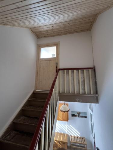 a staircase in a room with a stair case at D1 - Klein aber fein in Wernigerode