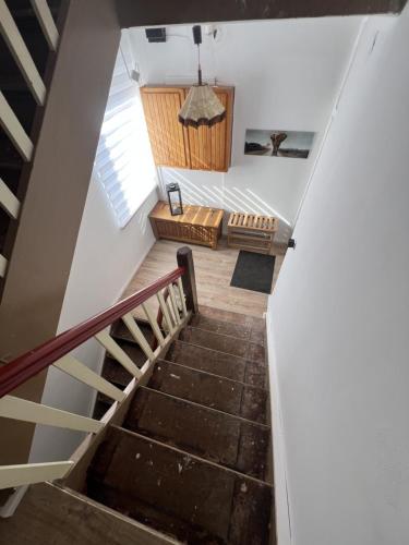 a staircase leading up to a living room with a couch at D1 - Klein aber fein in Wernigerode