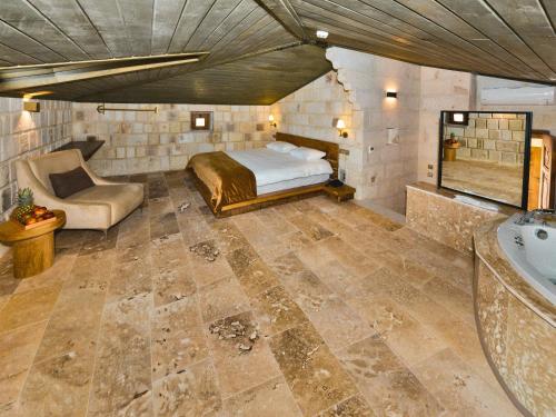 Ένα ή περισσότερα κρεβάτια σε δωμάτιο στο Evanthia Cave Suites - Special Class
