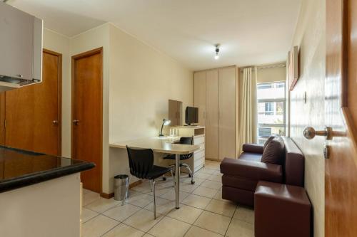 a small apartment with a kitchen and a living room at Verona Hplus Long Stay in Brasilia