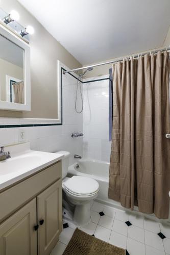 a bathroom with a toilet and a sink and a shower at Inspire the vibrant energy of Columbia University in New York