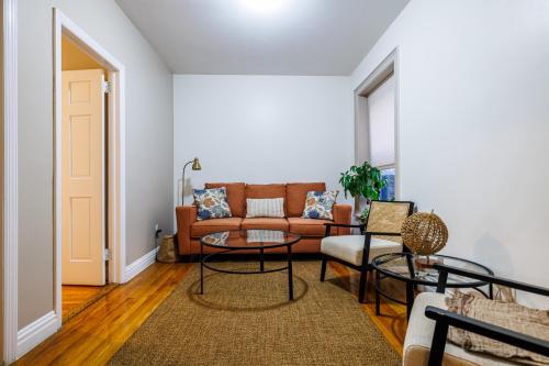 a living room with a couch and a table at Inspire the vibrant energy of Columbia University in New York