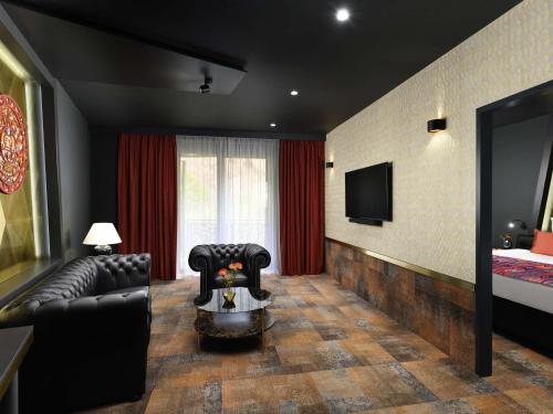 Телевизор и/или развлекательный центр в Minaro Hotel Tokaj - MGallery Collection