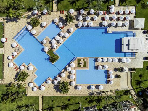 an overhead view of a pool at a resort at Rixos Sharm El Sheikh - Adults Only 18 Plus in Sharm El Sheikh