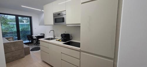 Una cocina o zona de cocina en Aupark Apartments