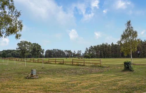 a pasture with a fence and a field with trees at Awesome Home In Everöd With Wifi in Everöd