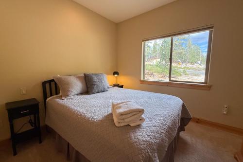 a bedroom with a bed with a towel on it at Tahoe Boulders in Stateline