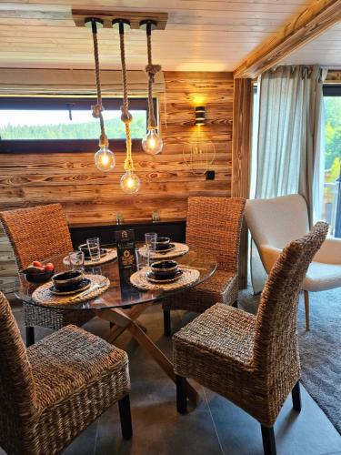 a dining room with a table and chairs at Chata u lanovky Pustevny in Trojanovice