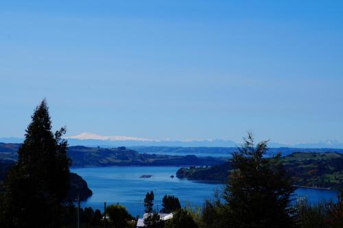 a view of a lake from a mountain at Cabañas Vista Tranquila Chiloé in Castro