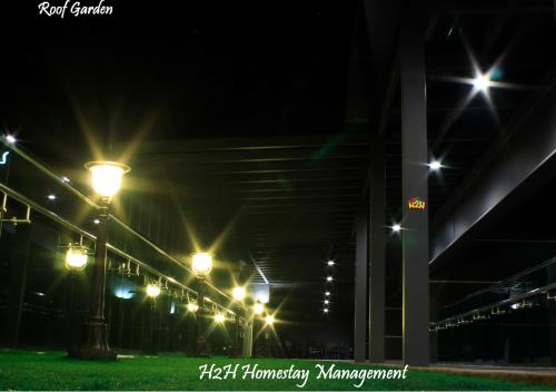 a row of street lights at night at H2H - Welcome Home - Majestic Ipoh - 5pax in Ipoh
