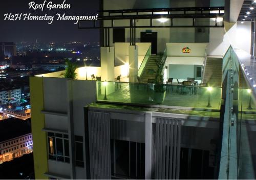 a view of a building with a balcony at night at H2H - Welcome Home - Majestic Ipoh - 5pax in Ipoh