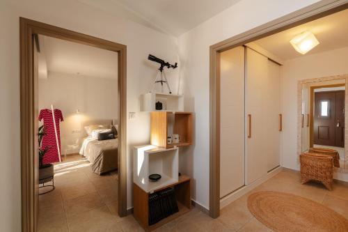 a room with a door leading to a bedroom at ZELION VILLA in Stelida