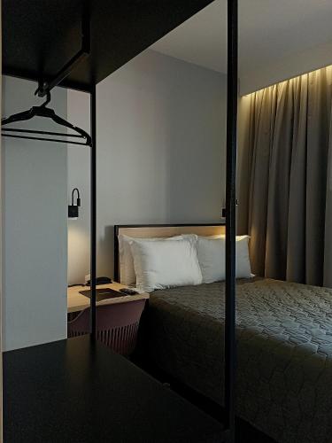 Postel nebo postele na pokoji v ubytování Hotel Merion