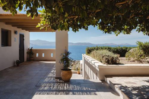 a house with a view of the ocean at ZELION VILLA in Stelida
